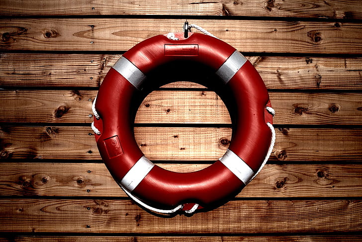 red and white life buoy