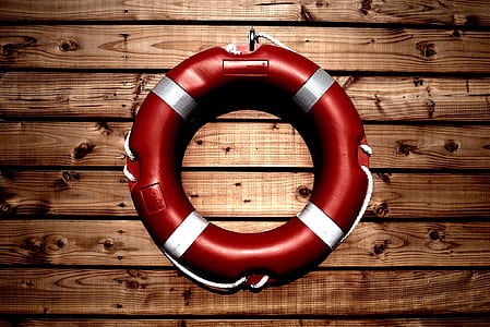 red and white life buoy