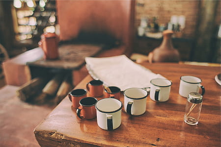 white and brown cups on table
