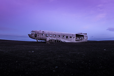 wrecked vintage carrier plane at open field