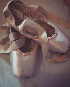 pair of white ballet shoes