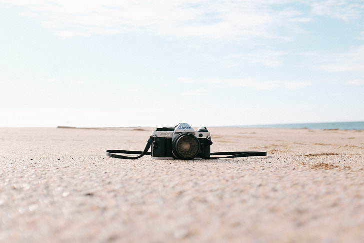 film camera on sand
