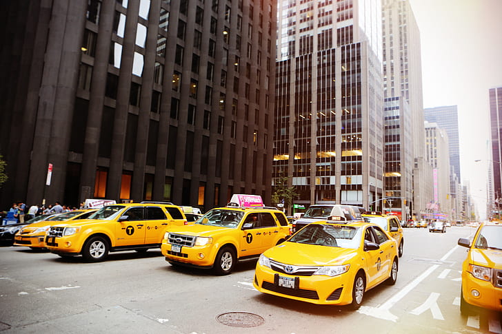 yellow taxi cars on road