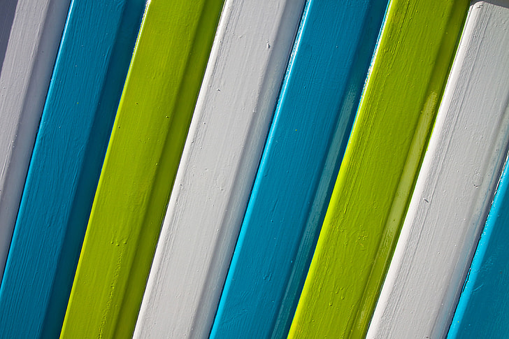 Details of brightly-coloured wooden panels, image captured in Kent, England
