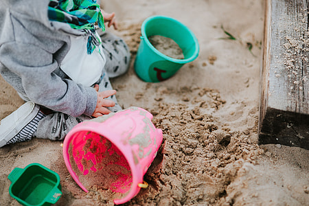 Toddler playing in the sand