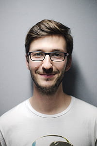 photo of man in white shirt wearing eyeglasses