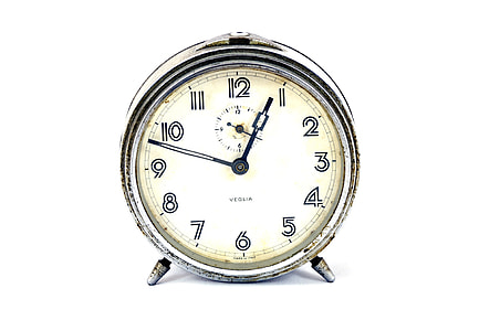 round stainless steel alarm clock