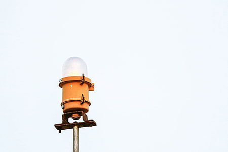low angle view of orange framed light post