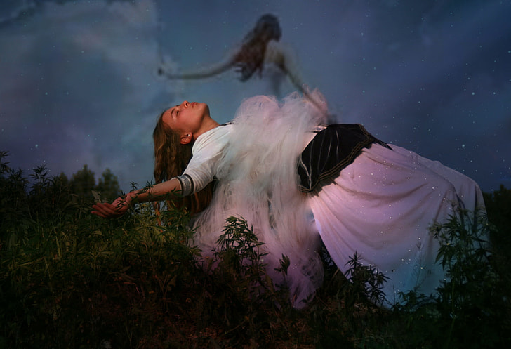 woman in white dress floating on air