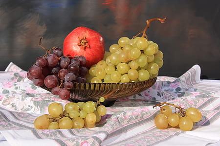 chardonnay and pinot noir with red pomegranate in brown glass bowl closeup photo