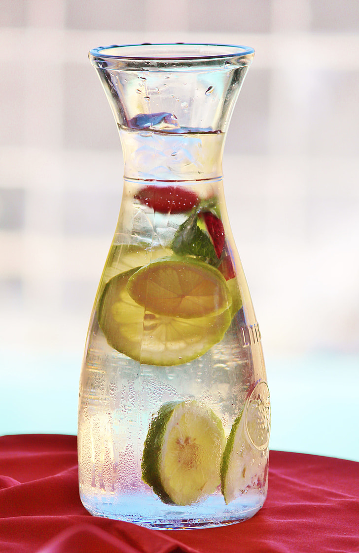 clear glass jar with water and lemon