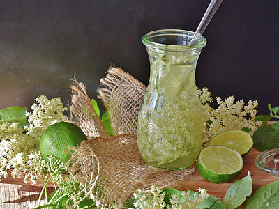 clear glass pitcher filled with lime juice