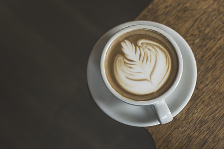 photo of brown coffee in white ceramic mug