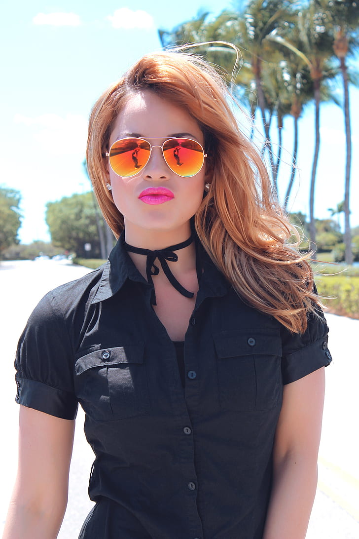 woman wearing black button-up shirt with sunglasses