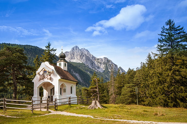 photo of chapel with mountains background
