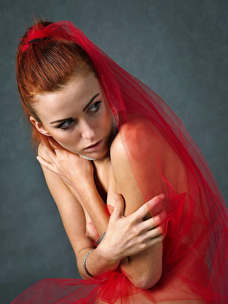 woman wearing red mesh veil