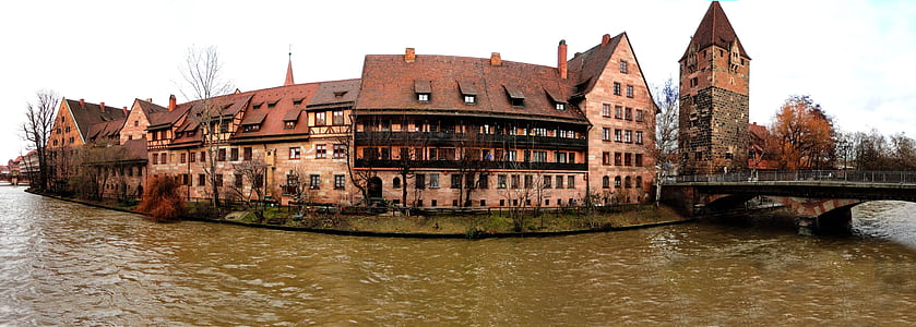 beige and brown castle on body of water