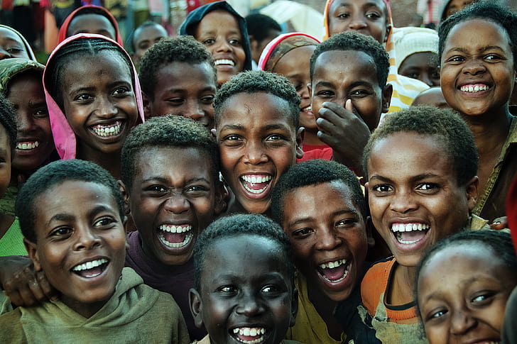 group of children smiling at daytime
