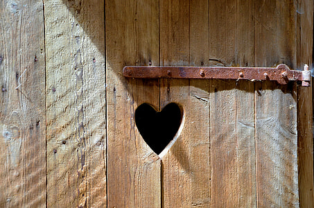heart-shaped brown wooden hole