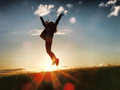 silhouette photo of jumping girl