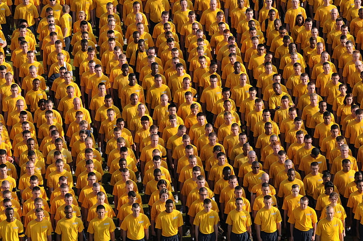 high-angle photography of men wearing yellow shirts