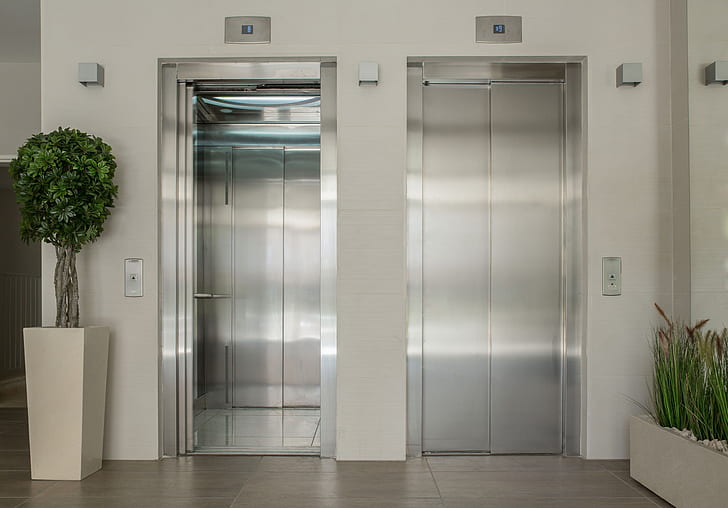 two grey elevators