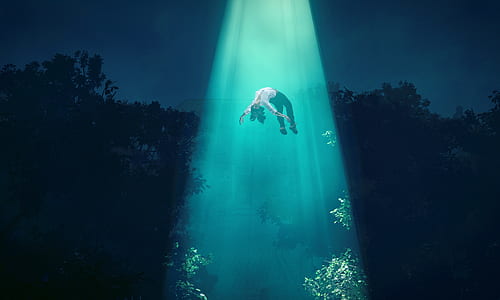 person floating in blue light