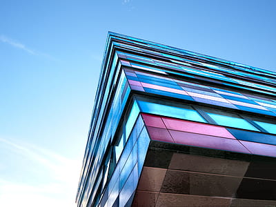 blue and pink building under blue sky