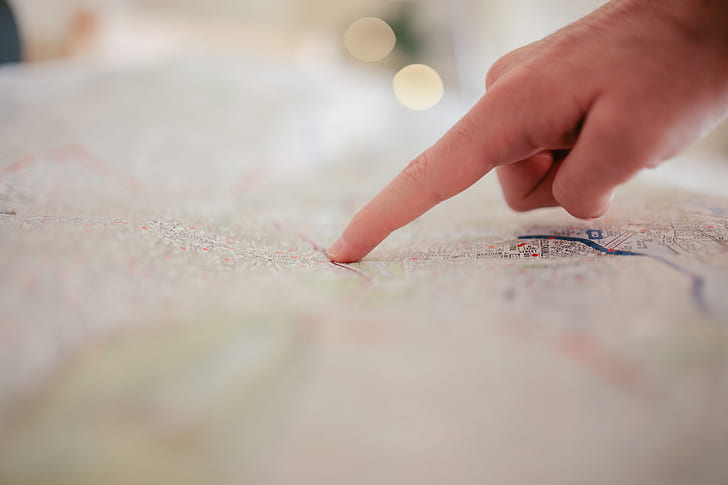 hand pointing on map