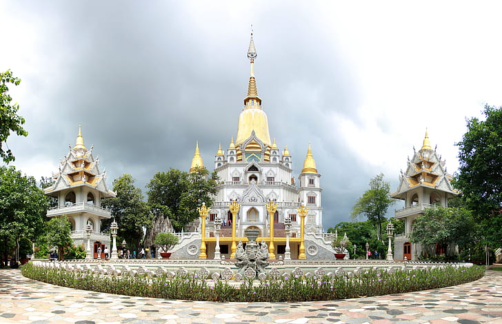 yellow and gray concrete temple with towers