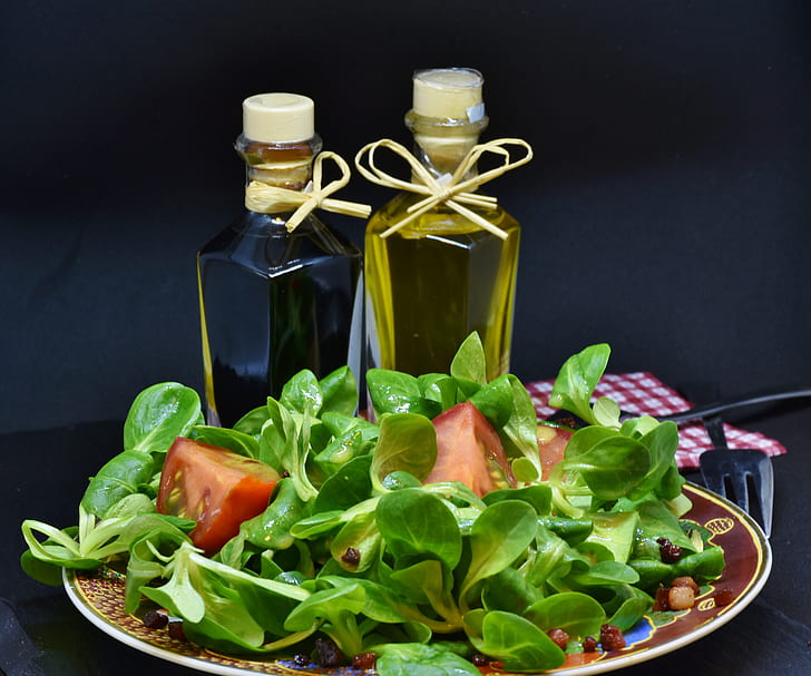 vegetable salad with olive oil bottles