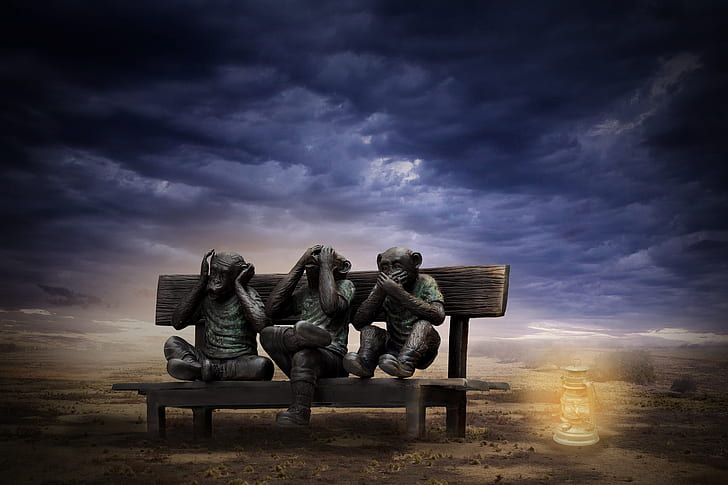 photograph of Three Wise Monkeys seating on bench