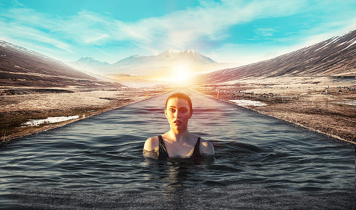 woman swimming on calm body of water