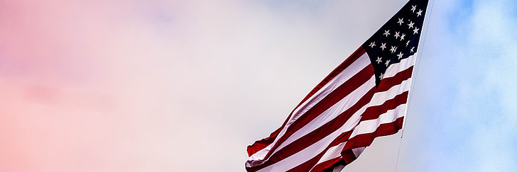shallow focus photography of U.S. flag
