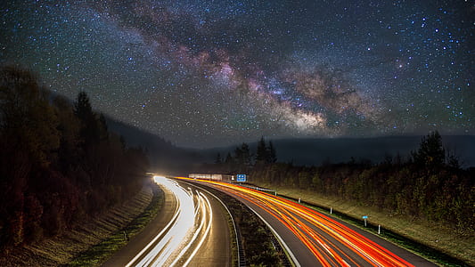 timelapse photography of cars passing through highway