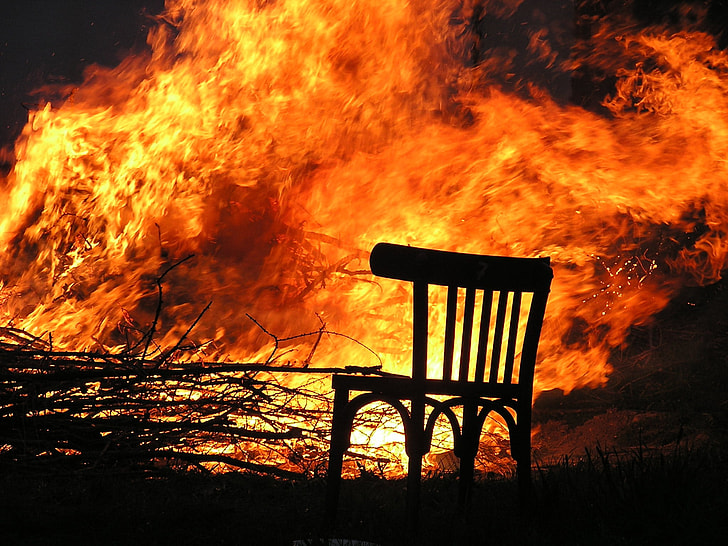 photo of chair near burning trees