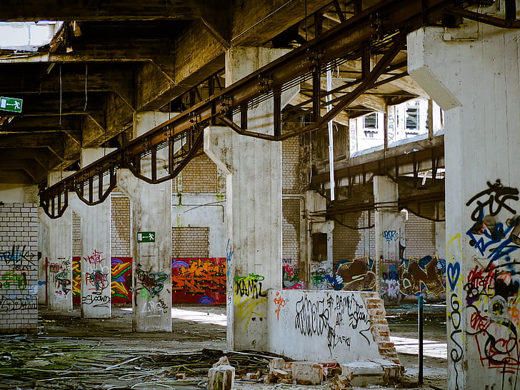 white building interior with assorted graffiti wall art