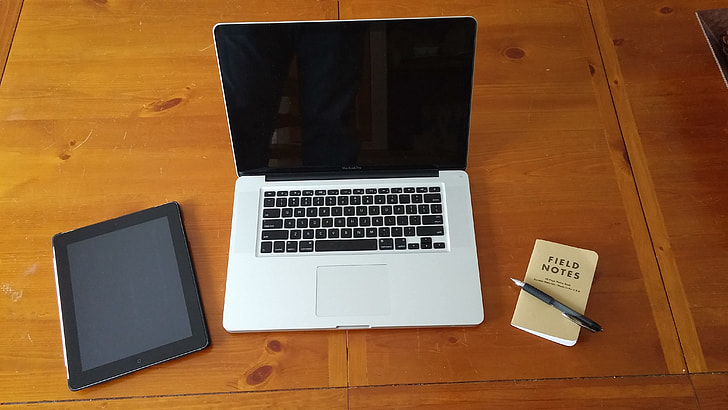 MacBook on table near space gray ipad