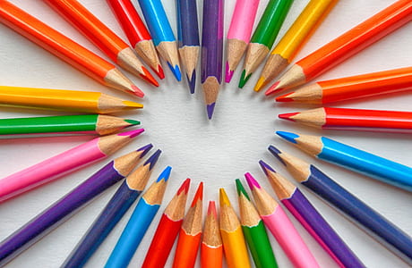 assorted-color pencils forming heart