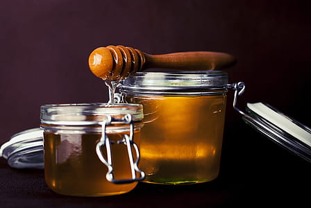 honey on clear glass canister