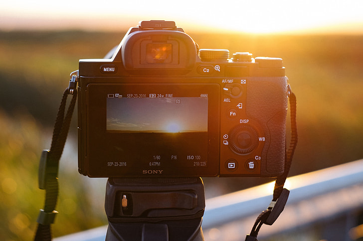 Camera on tripod at sunset