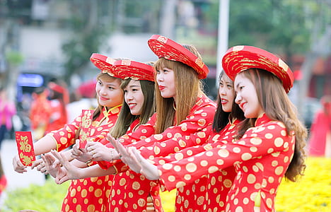 Five Women In Red And White Polka Dot Cheongsam Dress Standing