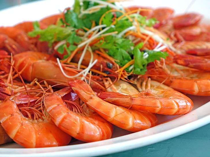 stewed shrimps on white ceramic platter