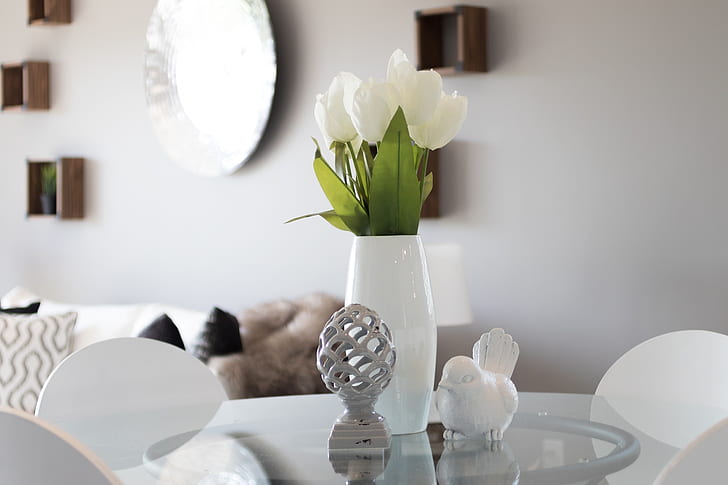 white tulips placed in white ceramic vase