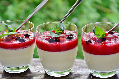 three clear glass with fruit shakes