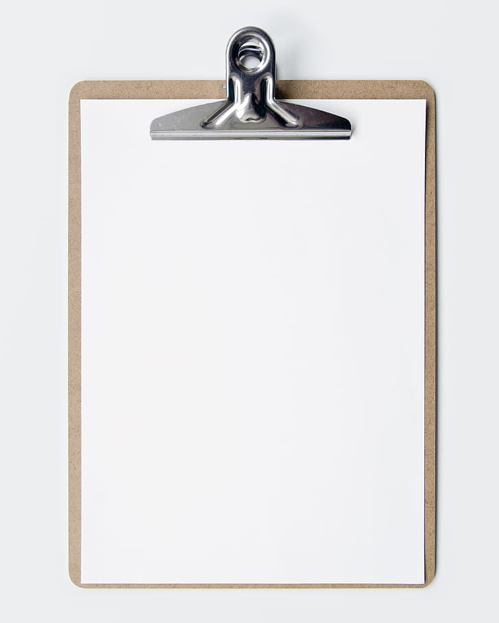 brown clipboard with white printing paper