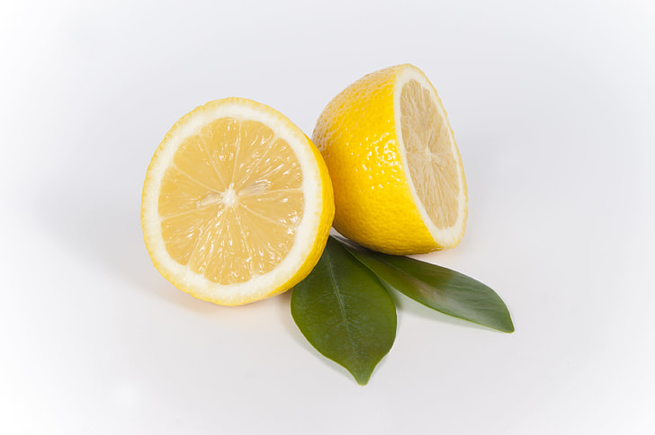 two sliced yellow lemon fruits