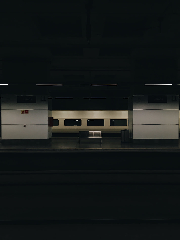landscape photo of train station bench