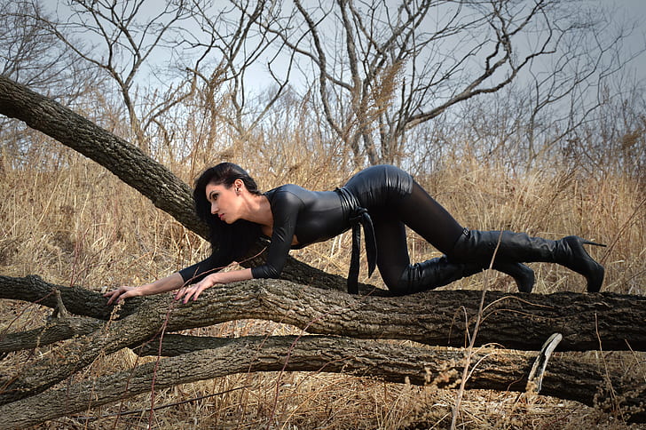 woman wearing black leather bodycon dress