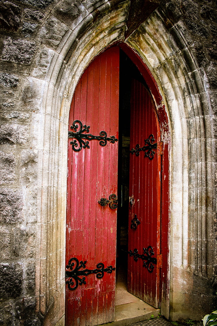 opened red wooden door